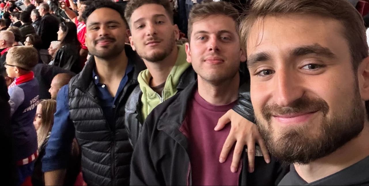 Four of the team at a football match